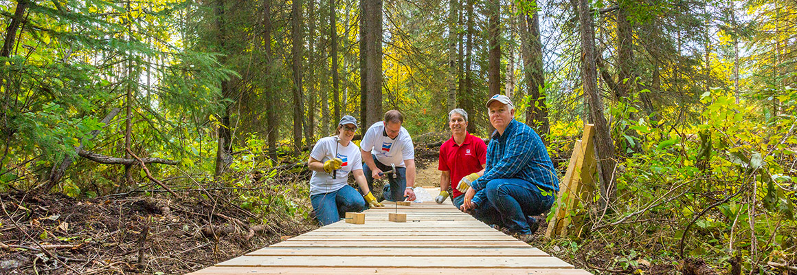 Chevron employees helping build the Fox Creek Nordic Trail