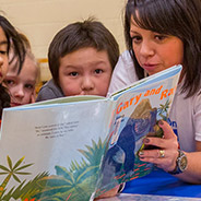 Chevron employee reading to children at Calgary Reads event