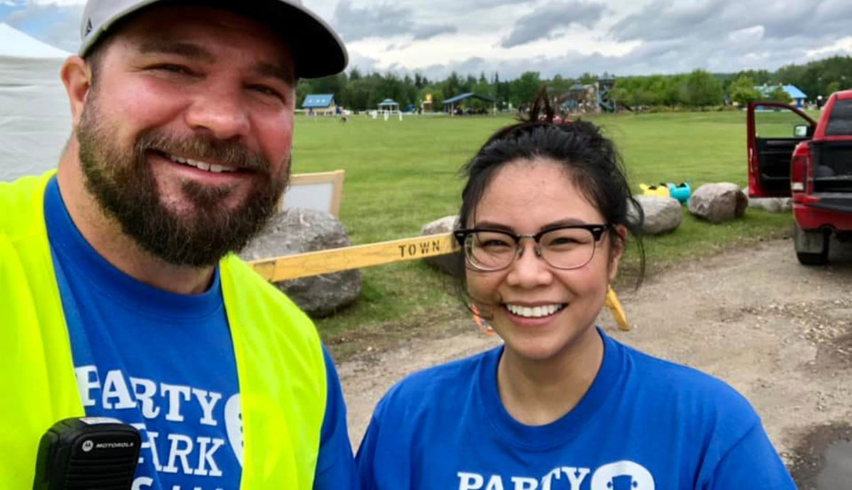 Two Chevron employees volunteering at the Whitecourt Party in the Park