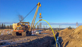 Installing color coded pipeline in Northern Alberta