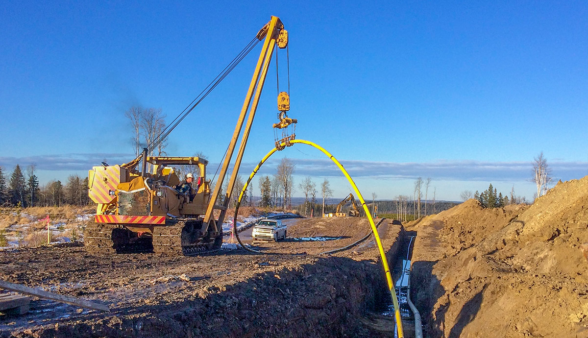 Installing color coded pipeline in Northern Alberta