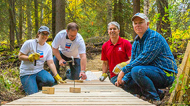 Chevron employees helping build the Fox Creek Nordic Trail