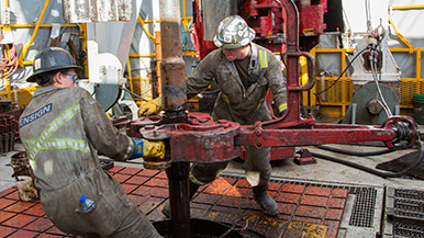 Contractors drilling a well