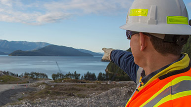 Chevron employee pointing at proposed Kitimat LNG plant site