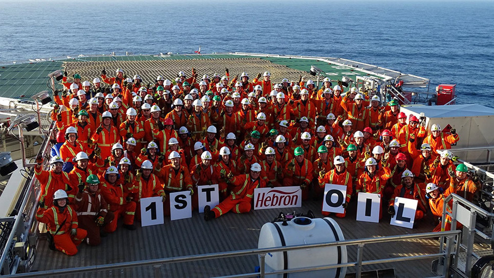 Workers on the Hebron Platform celebrate first oil
