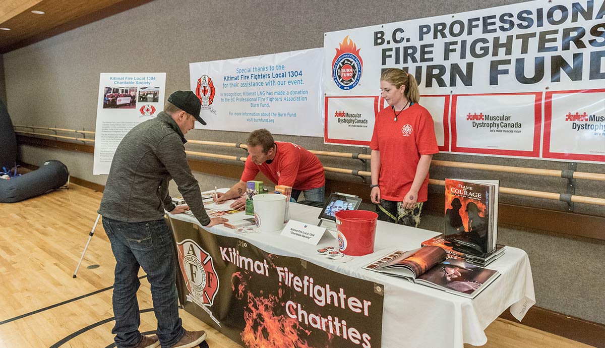Volunteers at the Kitimat Fire Fighters Burn Fund booth