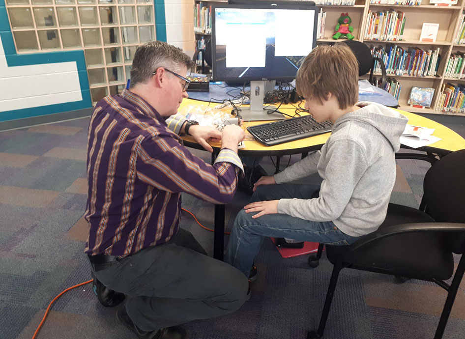 Chevron employee demonstrates how to use a breadboard with a Raspberry Pi