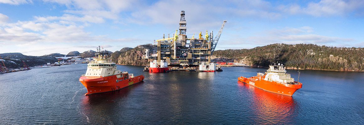 Hebron gravity-based structure being towed to deepwater-construction site at Bull Arm, Newfoundland and Labrador.
