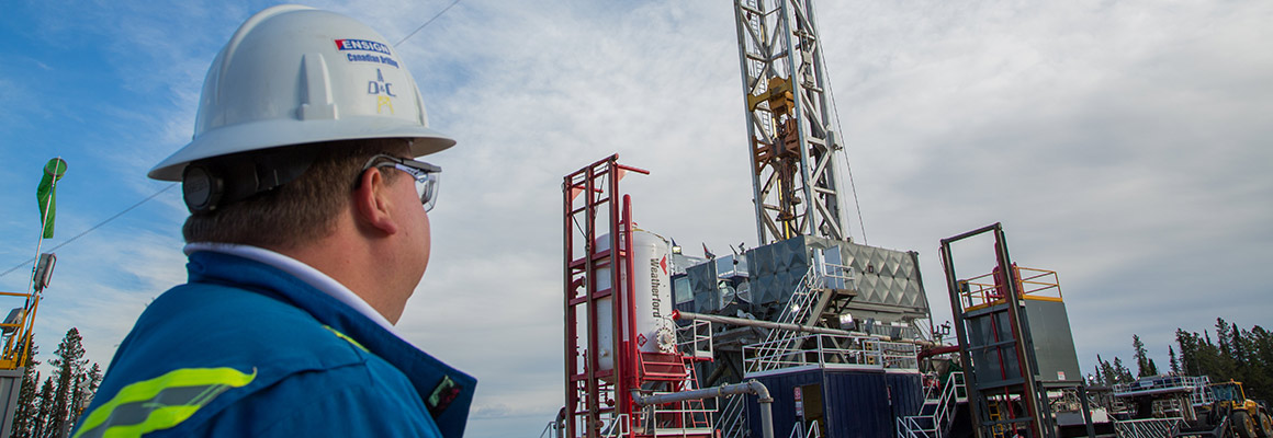Chevron Canada employee looking at a shale gas drilling platform in the Kaybob Duvernay region