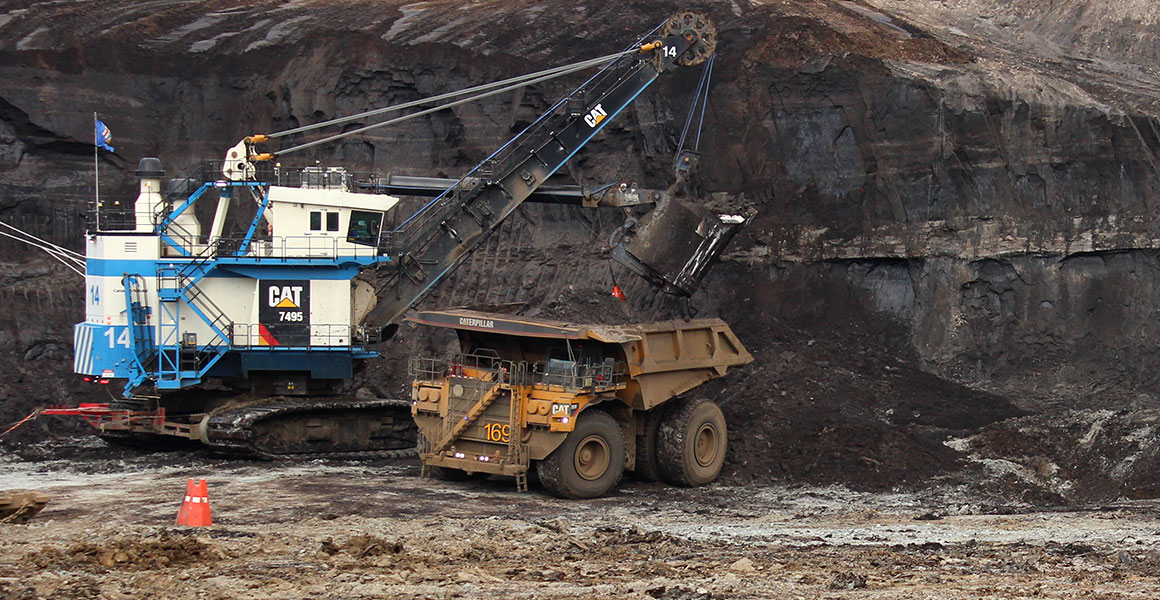 Electric excavator loading a truck at the Albian oil sands mine